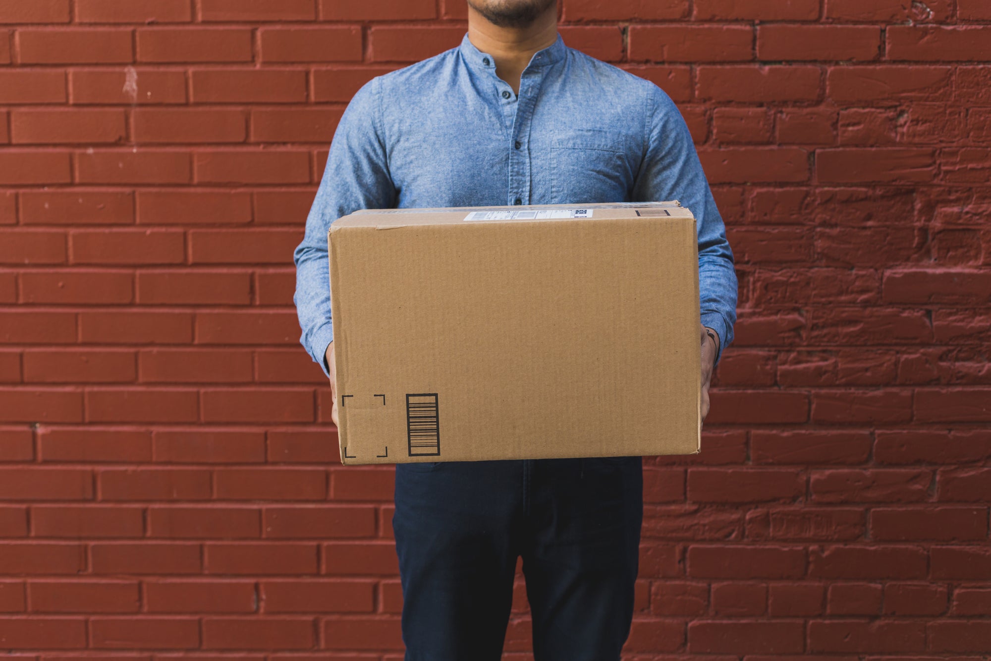 Man Holding Shipping Box - Cargo Packaging